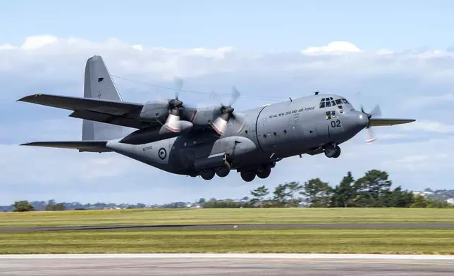 A Royal New Zealand Air Force Hercules C130 H takes off for Vanuatu, from Auckland, New Zealand, Wednesday, Dec. 18, 2024 following a strong earthquake that struck just off the coast of Vanuatu in the South Pacific Ocean, Tuesday, Dec. 17. (SGT Maria Eves/New Zealand Defence Force via AP)
