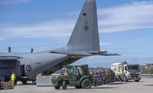 A Royal New Zealand Air Force Hercules C130 H is loaded up with supplies to deliver to Vanuatu, in Auckland, New Zealand, Wednesday, Dec. 18, 2024, following a strong earthquake that struck just off the coast of Vanuatu in the South Pacific Ocean, Tuesday, Dec. 17, 2024. (SGT Maria Eves/New Zealand Defence Force via AP)