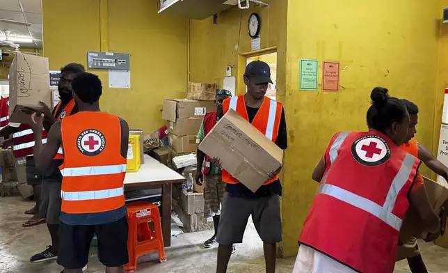 In this image released by Vanuatu Red Cross Society, its volunteers assist staff with the clean up at Vila Central Hospital in Port Vila, Vanuatu Wednesday, Dec. 18, 2024, following a powerful earthquake that struck just off the coast of Vanuatu in the South Pacific Ocean. (Vanuatu Red Cross Society via AP)