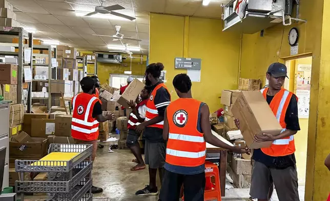 In this image released by Vanuatu Red Cross Society, its volunteers assist staff with the clean up at Vila Central Hospital in Port Vila, Vanuatu Wednesday, Dec. 18, 2024, following a powerful earthquake that struck just off the coast of Vanuatu in the South Pacific Ocean. (Vanuatu Red Cross Society via AP)