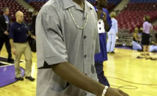 FILE - Cleveland Cavaliers rookie LeBron James walks across the court at Arco Arena after arriving with the team in Sacramento, Calif., on Oct. 29, 2003. (AP Photo/Rich Pedroncelli, File)