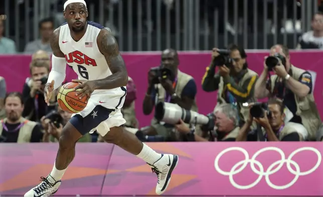 FILE - United States' Lebron James looks up the court during the first half of a preliminary men's basketball game against France at the 2012 Summer Olympics, on July 29, 2012, in London. (AP Photo/Charles Krupa, File)