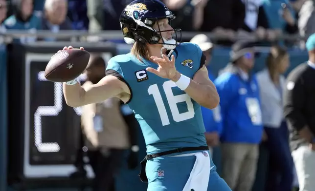 Jacksonville Jaguars quarterback Trevor Lawrence warms up before an NFL football game against the Houston Texans Sunday, Dec. 1, 2024, in Jacksonville, Fla. (AP Photo/John Raoux)