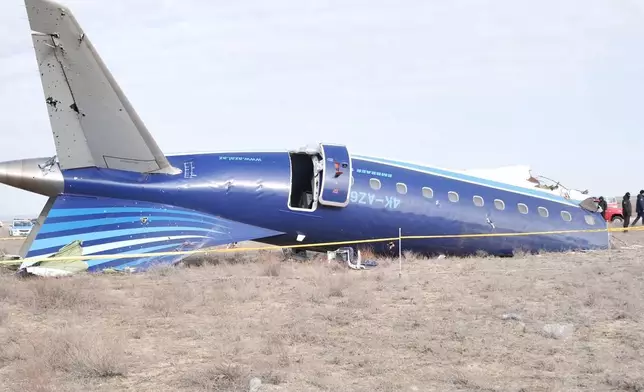 In this photo taken from a video released by the administration of Mangystau region, the wreckage of Azerbaijan Airlines Embraer 190 lies on the ground near the airport of Aktau, Kazakhstan, Wednesday, Dec. 25, 2024. (The Administration of Mangystau Region via AP)