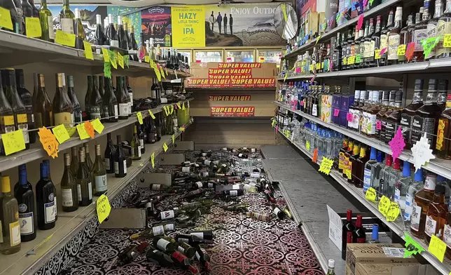 Broken bottles are scattered on the floor inside E&amp;J Liquors after a 7.0 magnitude earthquake, Thursday, Dec. 5, 2024, in Rio Dell, Calif. (Savana Robinson via AP )