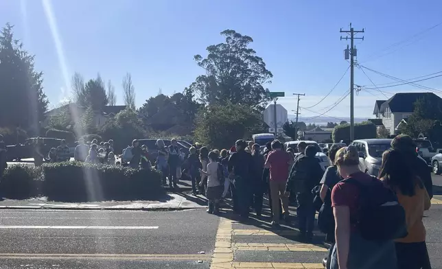 Students walk in line as they are evacuated from Laurel Tree Charter School to Arcata High School after an earthquake Thursday, Dec. 5, 2024, in Arcata, Calif. (Sage Alexander/The Times-Standard via AP)