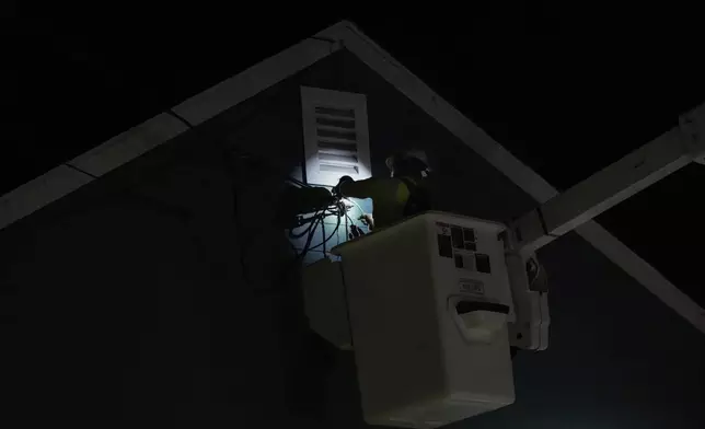 PG&amp;E troubleman Justin Biondini responds to a service call at a home following a 7.0 magnitude earthquake Thursday, Dec. 5, 2024, in Rio Dell, Calif. (AP Photo/Godofredo A. Vásquez)