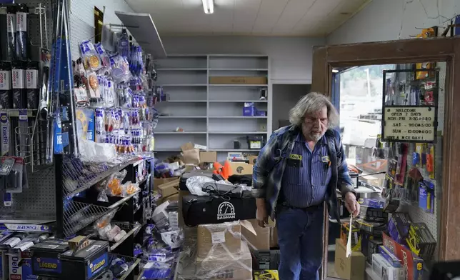 FILE - Kenny Ransbottom walks through debris inside his auto parts store after an earthquake in Rio Dell, Calif., on Dec. 20, 2022. (AP Photo/Godofredo A. Vásquez, File)