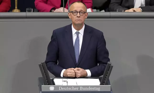 Opposition leader Friedrich Merz of CDU speaks during a plenary session at the German parliament Bundestag where he faces a vote of confidence, Berlin, Germany, Monday, Dec. 16, 2024. (AP Photo/Markus Schreiber)