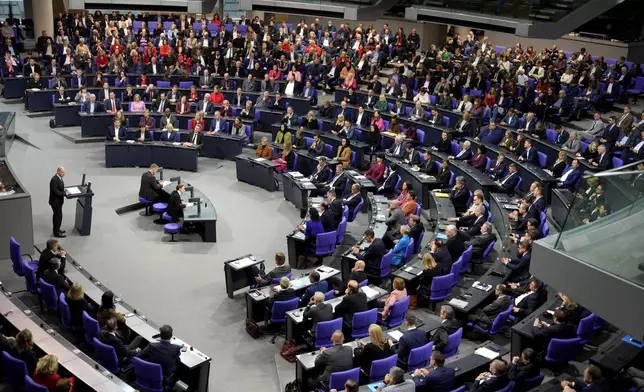 German Chancellor Olaf Scholz speaks during a plenary session at the German parliament Bundestag where he faces a vote of confidence, Berlin, Germany, Monday, Dec. 16, 2024. (AP Photo/Markus Schreiber)