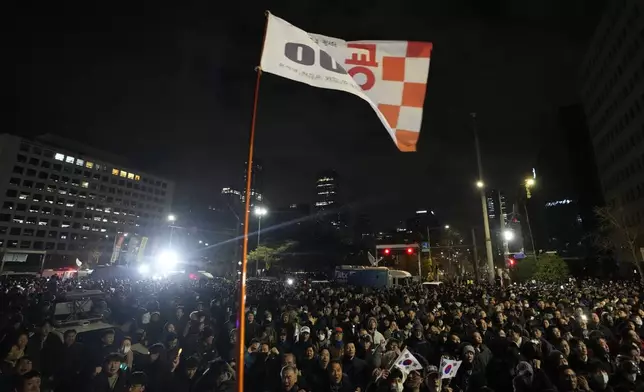 People gather in front of the National Assembly in Seoul, South Korea, Wednesday, Dec. 4, 2024. (AP Photo/Ahn Young-joon)