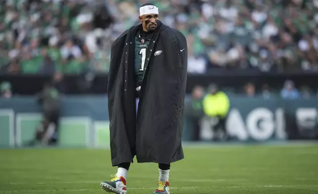 Philadelphia Eagles quarterback Jalen Hurts (1) watches after Philadelphia Eagles safety C.J. Gardner-Johnson is injured during the second half of an NFL football game against the Carolina Panthers on Sunday, Dec. 8, 2024, in Philadelphia. (AP Photo/Matt Slocum)