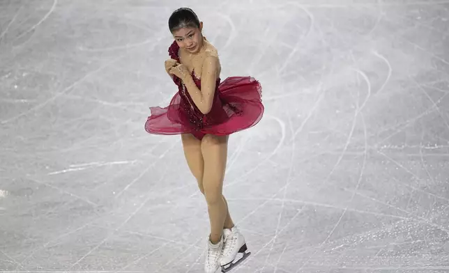 Mone Chiba, of Japan, competes in the women's free skating segment at the ISU Grand Prix Finals of Figure Skating, Saturday, Dec. 7, 2024, in Grenoble, France. (AP Photo/Laurent Cipriani)