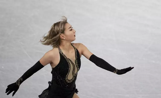 Kaori Sakamoto, of Japan, competes in the women's free skating segment at the ISU Grand Prix Finals of Figure Skating, Saturday, Dec. 7, 2024, in Grenoble, France. (AP Photo/Laurent Cipriani)