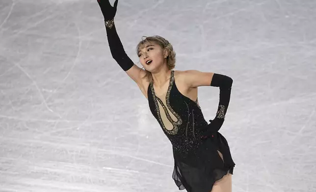 Kaori Sakamoto, of Japan, competes in the women's free skating segment at the ISU Grand Prix Finals of Figure Skating, Saturday, Dec. 7, 2024, in Grenoble, France. (AP Photo/Laurent Cipriani)