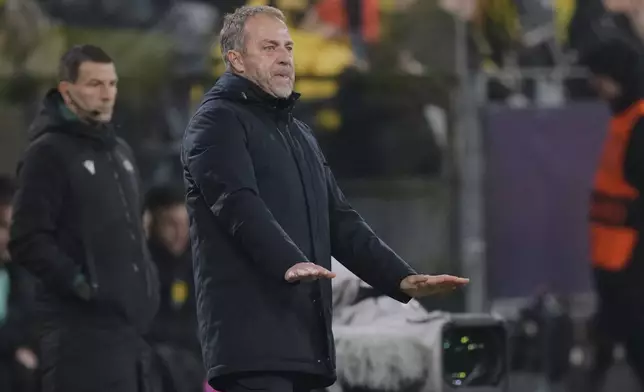 Barcelona's head coach Hansi Flick reacts during the Champions League opening phase soccer match between Borussia Dortmund and FC Barcelona at the Signal-Iduna Park in Dortmund, Germany, Wednesday Dec. 11, 2024. (AP Photo/Martin Meissner)