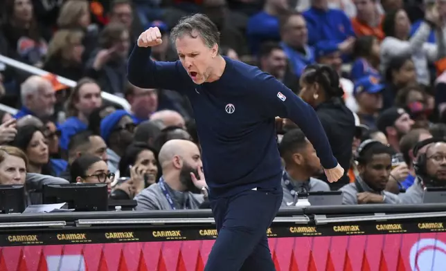 Washington Wizards head coach Brian Keefe reacts to a foul called against his team during the first half of an NBA basketball game against the New York Knicks, Saturday, Dec. 28, 2024, in Washington. (AP Photo/Terrance Williams)