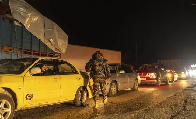 A member of the security forces of the newly formed Syrian government stands on guard at a security checkpoint on the Syrian border with Lebanon, Friday, Dec. 27, 2024 (AP Photo/Mosa'ab Elshamy)