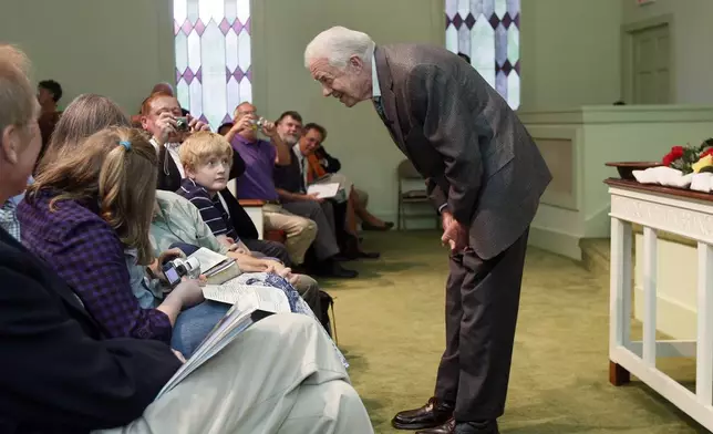 FILE - President Jimmy Carter teaches Sunday school at Maranatha Baptist Church in Plains, Ga., Sept. 22, 2009. (AP Photo/John Bazemore, File)