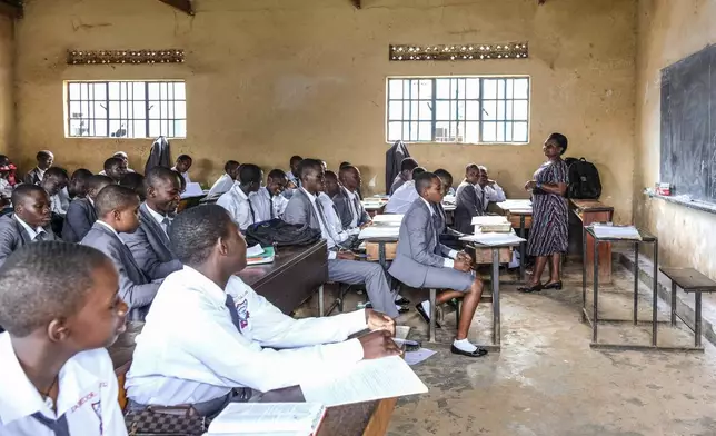 A teacher gives a lesson to his students at Wampewo Ntakke Secondary School in Kawempe tula village, Kampala, Uganda on Nov. 4, 2024. (AP Photo/Hajarah Nalwadda)