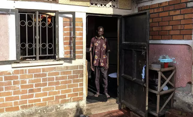 Moses Serikomawa, father of seven poses for a photo at his home in Kawempe tula village, Kampala, Uganda on Nov. 12, 2024. (AP Photo/Hajarah Nalwadda)