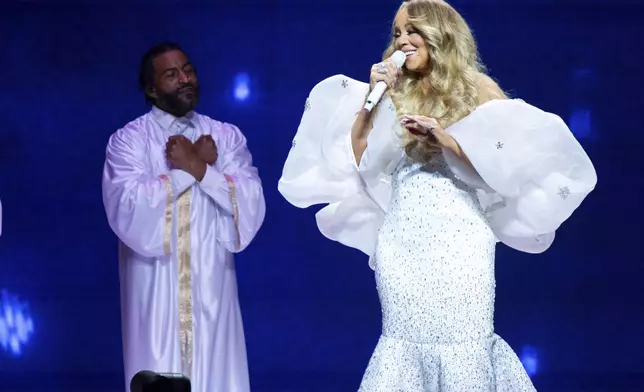 FILE - Mariah Carey performs during the Mariah Carey's Christmas Time tour on Saturday, Nov. 23, 2024, at State Farm Arena in Atlanta. (Photo by Paul R. Giunta/Invision/AP, file)