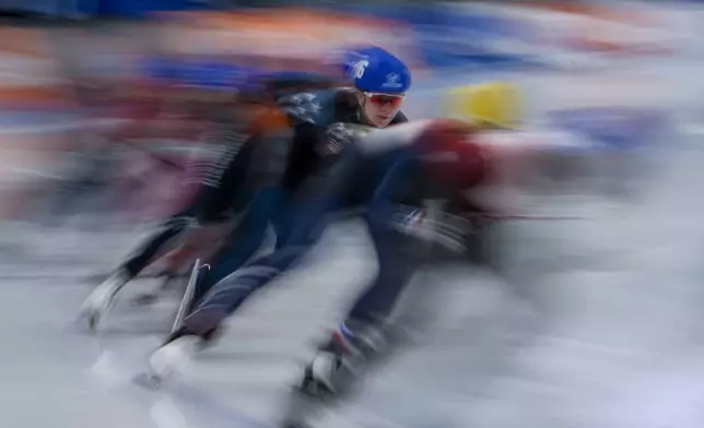 Competitors take part in the Mass Start Men race of the ISU World Cup Speed Skating Beijing 2024 held at the National Speed Skating Oval in Beijing, Sunday, Dec. 1, 2024. (AP Photo/Ng Han Guan)