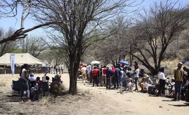 Namibians queue to cast their votes in presidential elections in Windhoek, Namibia, Wednesday, Nov. 27, 2024. (AP Photo/Dirk Heinrich)