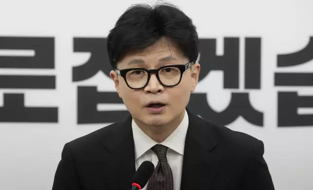 South Korea's ruling People Power Party leader Han Dong-hun speaks during a news conference to announce his resignation after President Yoon Suk Yeol's parliamentary impeachment, at the National Assembly in Seoul, South Korea, Monday, Dec. 16, 2024. (AP Photo/Ahn Young-joon)