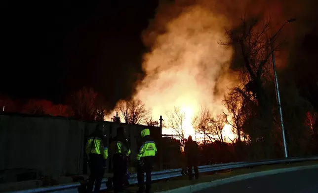 Firefighters respond to a wood fire Thursday, Dec. 5, 2024, in the Woodberry neighborhood in north Baltimore. (Kenneth K. Lam/The Baltimore Sun via AP)