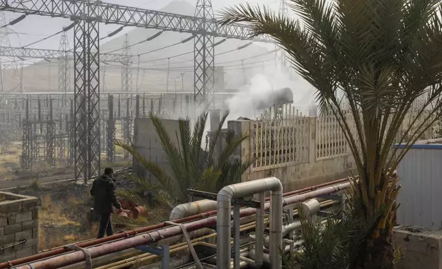 Smoke rises from the scene of an Israeli airstrike on the Haziz power station in southern Sanaa, Yemen, Thursday, Dec. 19, 2024. A series of intense Israeli airstrikes rocked Yemen's rebel-held capital and a port city early Thursday, killing at least nine people, according to officials. The strikes followed a Houthi missile attack on central Israel. (AP Photo/Osamah Abdulrahman)