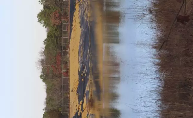 Water sits in a lined pit at the former Ciba-Geigy chemical plant on Dec. 17, 2024, in Toms River, N.J., one of America's most notorious toxic waste sites. (AP Photo/Wayne Parry)