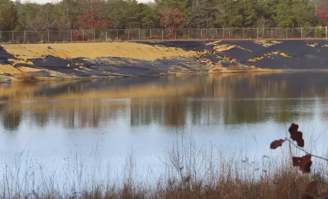 Water sits in a lined pit at the former Ciba-Geigy chemical plant on Dec. 17, 2024, in Toms River, N.J., one of America's most notorious toxic waste sites. (AP Photo/Wayne Parry)