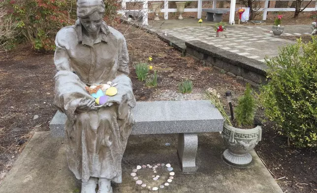 FILE - A sculpture of a grieving mother at a memorial garden in Toms River, N.J., for children who died from any cause is shown on Feb. 21, 2023. (AP Photo/Wayne Parry, File)