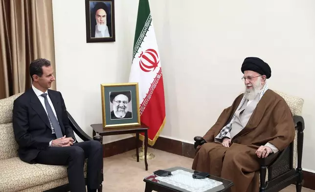 FILE - In this photo released by the official website of the office of the Iranian supreme leader, Supreme Leader Ayatollah Ali Khamenei, right, speaks with Syrian President Bashar Assad in a meeting in Tehran, Iran, May 30, 2024. (Office of the Iranian Supreme Leader via AP, File)