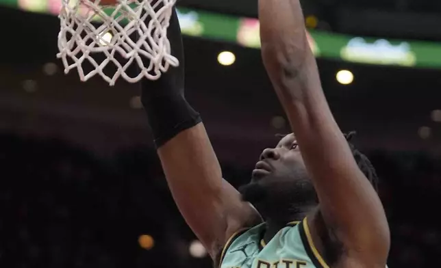 Charlotte Hornets center Mark Williams dunks during the first half of an NBA basketball game against the Chicago Bulls, Friday, Dec. 13, 2024, in Chicago. (AP Photo/Erin Hooley)