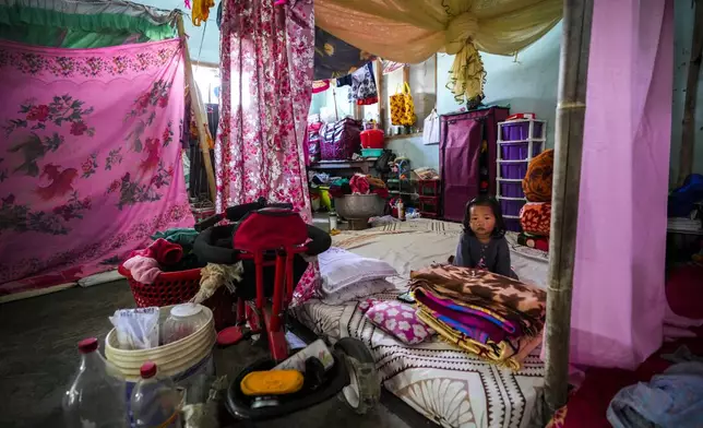 A Meitei girl sits in a relief camp in Imphal, Manipur, Monday, Dec. 16, 2024. (AP Photo/Anupam Nath)