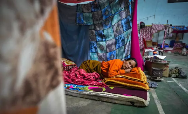 A Meitei woman rests in a relief camp in Imphal, Manipur, Monday, Dec. 16, 2024. (AP Photo/Anupam Nath)