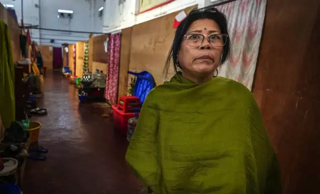 Yengsom Junksom Memi, a Meitei, talks to Associated Press n a relief camp in Imphal, Manipur, Monday, Dec. 16, 2024. Mimi, used to live in Kangpokpi when attackers rampaged her home and forced her family to run for their lives, Memi first took refuge in a police station, before moving to a relief center in Imphal where she lives with other 600 displaced Meiteis. She said her house has since been taken over by the attackers. (AP Photo/Anupam Nath)