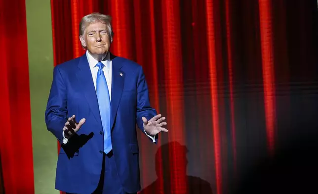 President-elect Donald Trump takes the stage before speaking at the FOX Nation Patriot Awards, Thursday, Dec. 5, 2024, in Greenvale, N.Y. (AP Photo/Heather Khalifa)