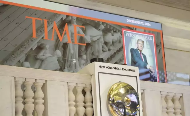 A cover of Time magazine's person of the year, shows President-elect Donald Trump, before he arrives to ring the opening bell at the New York Stock Exchange, Thursday, Dec. 12, 2024, in New York. (AP Photo/Alex Brandon)