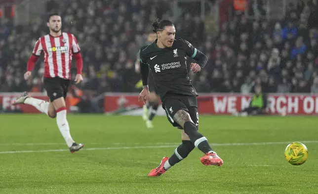 Liverpool's Darwin Nunez scores during the English Football Lague Cup soccer match between Southampton and Liverpool in Southampton, England, on Wednesday, Dec.18, 2024. (AP Photo/Sean Ryan)