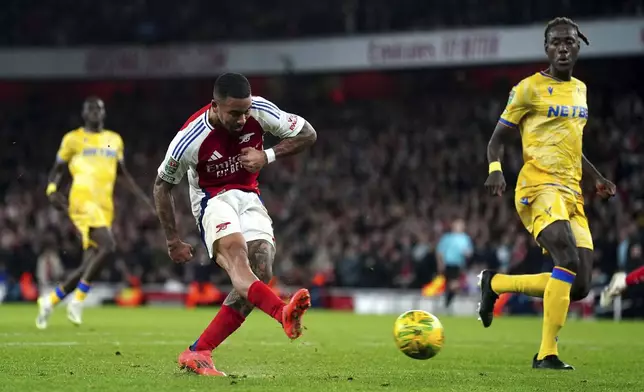 Arsenal's Gabriel Jesus scores his side's third goal during the English League Cup quarterfinal soccer match between Arsenal and Crystal Palace at Emirates stadium in London, Wednesday, Dec. 18, 2024. (Mike Egerton/PA via AP)