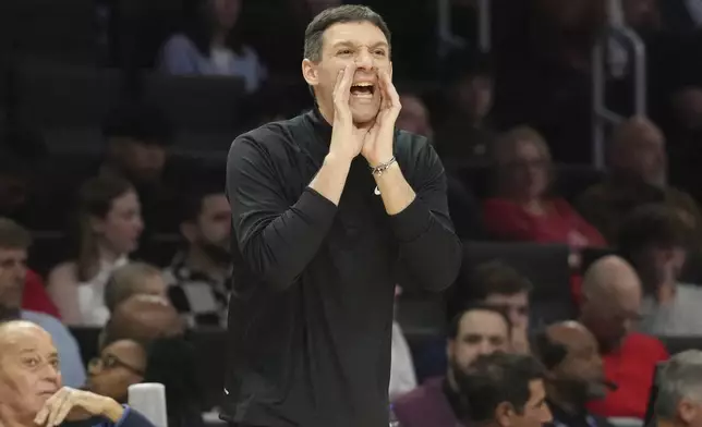 Oklahoma City Thunder head coach Mark Daigneault gestures during the first half of an NBA basketball game against the Miami Heat, Friday, Dec. 20, 2024, in Miami. (AP Photo/Marta Lavandier)