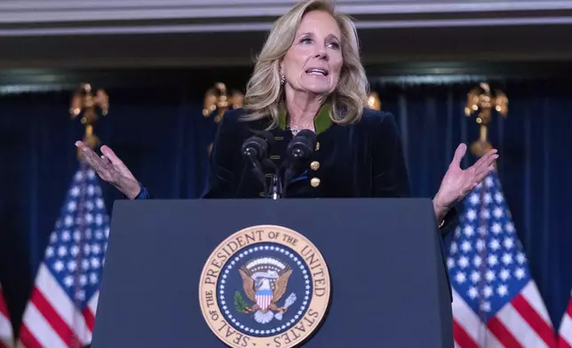 First lady Jill Biden delivers her remarks at the Democratic National Committee's Holiday Reception at Willard Hotel in Washington, Sunday, Dec. 15, 2024. (AP Photo/Jose Luis Magana)