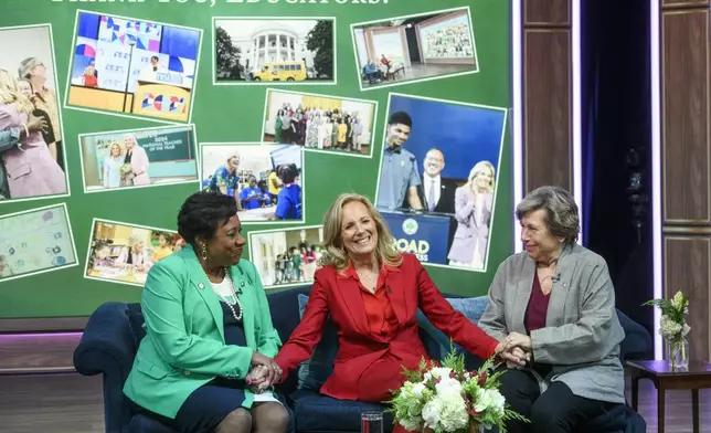 First lady Jill Biden, center, is joined by Becky Pringle, president of the National Education Association, left, and Randi Weingarten, president of American Federation of Teachers , right, during a virtual thank you event for educators with the American Federation of Teachers and the National Education Association, in the South Court Auditorium on the White House complex in Washington, Monday, Dec. 16, 2024. (AP Photo/Rod Lamkey, Jr.)