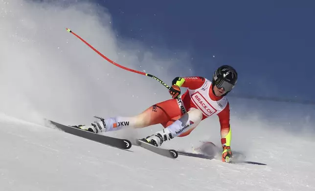 Switzerland's Lara Gut Behrami competes in an alpine ski, women's World Cup super G, in St. Moritz, Switzerland, Saturday, Dec. 21, 2024. (AP Photo/Marco Trovati)