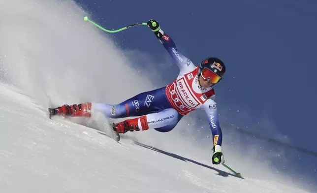 Italy's Sofia Goggia competes in an alpine ski, women's World Cup super G, in St. Moritz, Switzerland, Saturday, Dec. 21, 2024. (AP Photo/Marco Trovati)