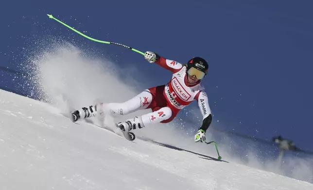 Austria's Cornelia Huetter competes in an alpine ski, women's World Cup super G, in St. Moritz, Switzerland, Saturday, Dec. 21, 2024. (AP Photo/Marco Trovati)