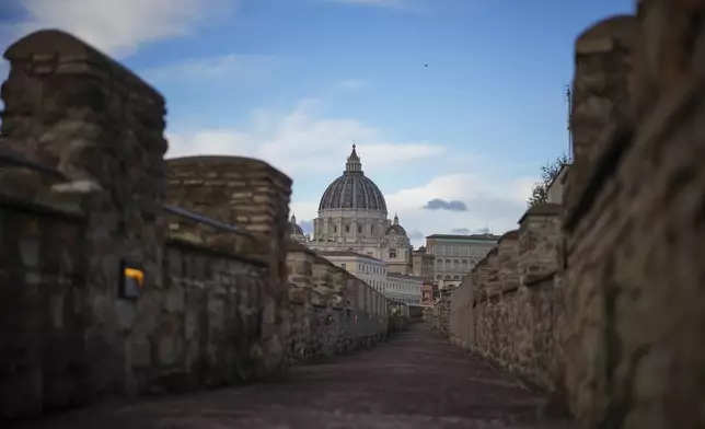 A view of the elevated secret narrow 800-meter corridor, known as "Passetto", that runs atop the old Vatican walls between the Popes' Vatican palace and the Castel Sant'Angelo fortress, which was used during the Sack of Rome in 1527 by Pope Clement VII to escape and take refuge in the fortress, as it is reopened to the public just ahead of the Jubilee Year, an event expected to draw millions of visitors to the Eternal City, in Rome, Monday, Dec. 23, 2024. (AP Photo/Andrew Medichini)